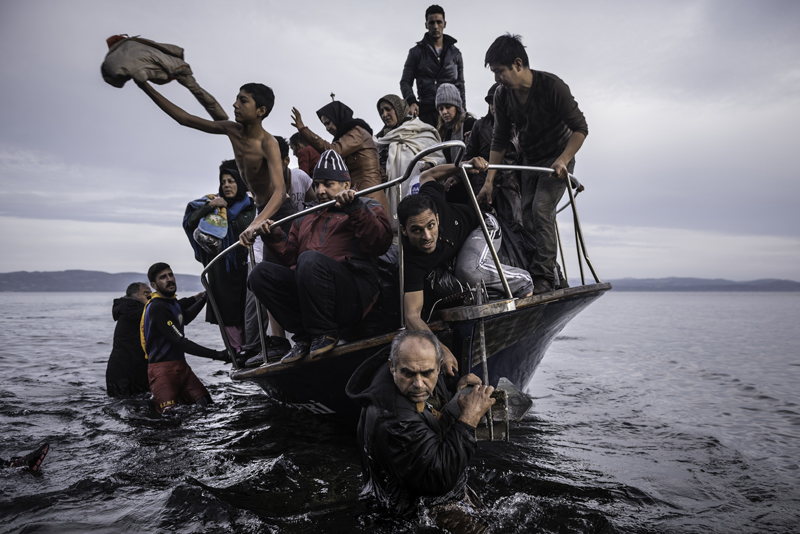 Sergey Ponomarev. Migrants arrive by a Turkish boat near the village of Skala. Russia